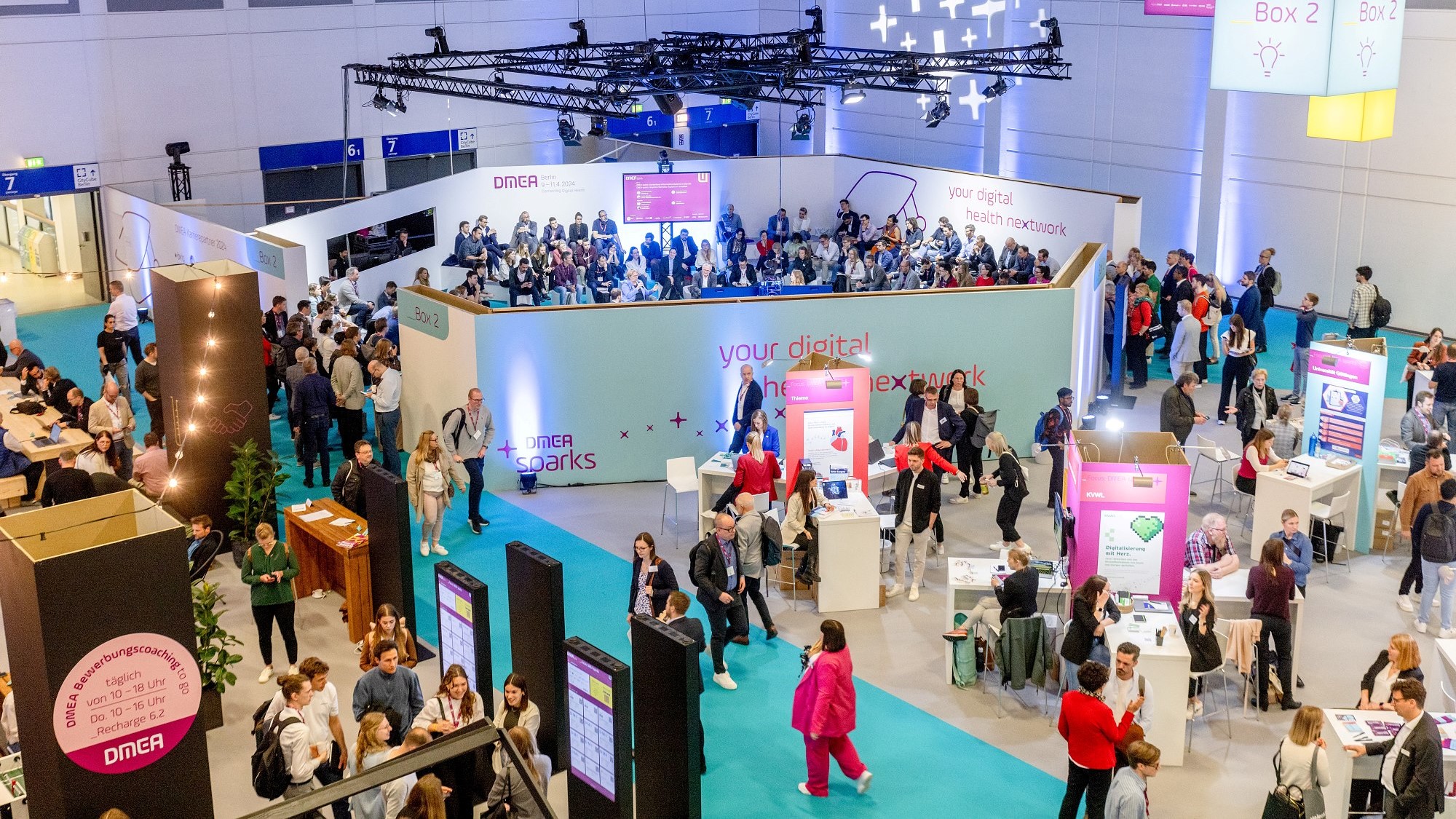A bird's eye view of the DMEA sparks area, with the stage in the background