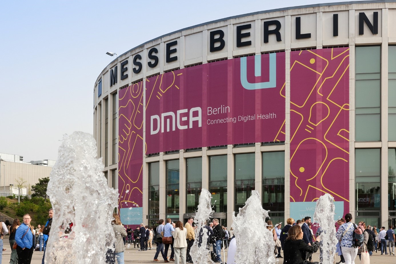 Entrance to Messe Berlin with the DMEA megabanner, water fountains in the foreground 