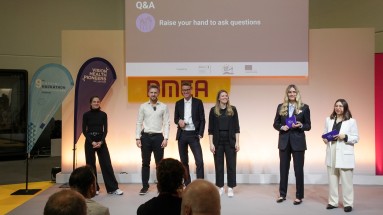 Six people stand on a stage at DMEA 2025.