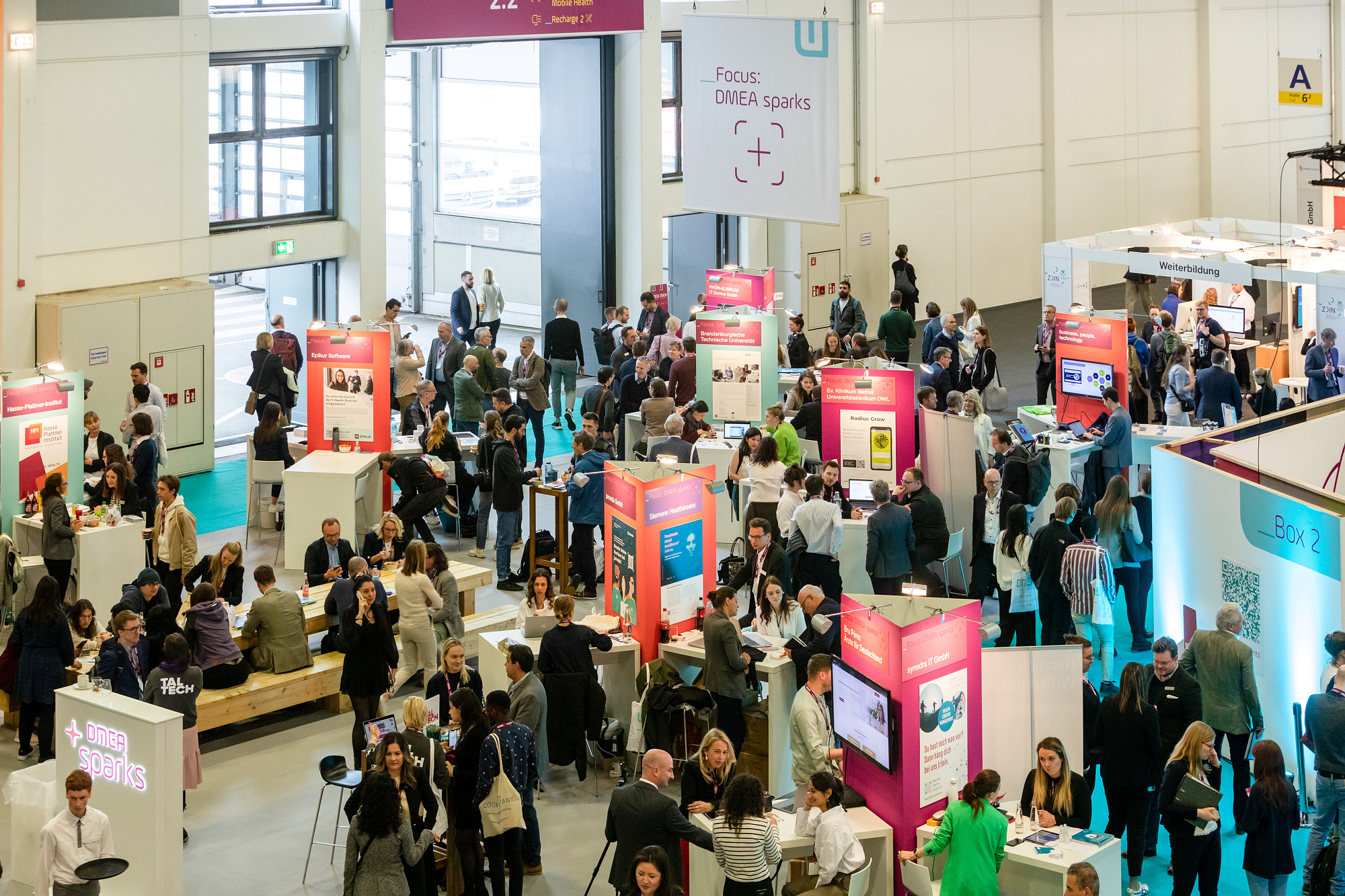 DMEA sparks area – people in conversation viewed from above DMEA sparks area – people in conversation viewed from above